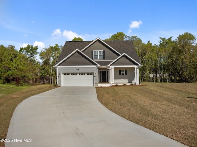 craftsman house featuring a porch, driveway, a front yard, and a garage