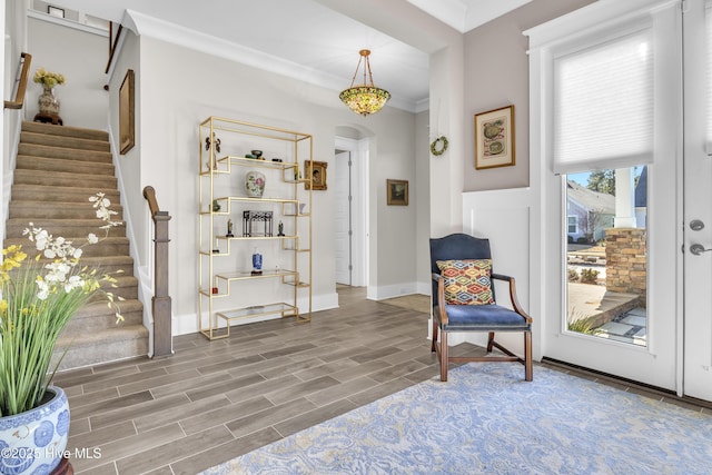 living area featuring crown molding