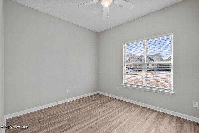 2214 Splitbrook Ct, Wilmington, NC 28411 - spare room featuring wood finished floors, a ceiling fan, and baseboards