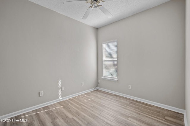 2214 Splitbrook Ct, Wilmington, NC 28411 - spare room featuring light wood-style floors, ceiling fan, a textured ceiling, and baseboards