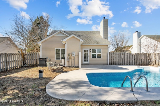 2214 Splitbrook Ct, Wilmington, NC 28411 - back of house with a patio, a fenced backyard, central AC unit, and a chimney