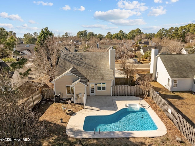 2214 Splitbrook Ct, Wilmington, NC 28411 - back of house featuring a patio area, a fenced backyard, a chimney, and central AC unit