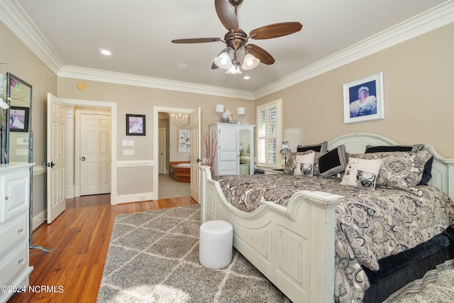 bedroom with ornamental molding, hardwood / wood-style floors, and ceiling fan