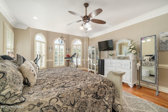 bedroom featuring crown molding, light hardwood / wood-style flooring, and ceiling fan