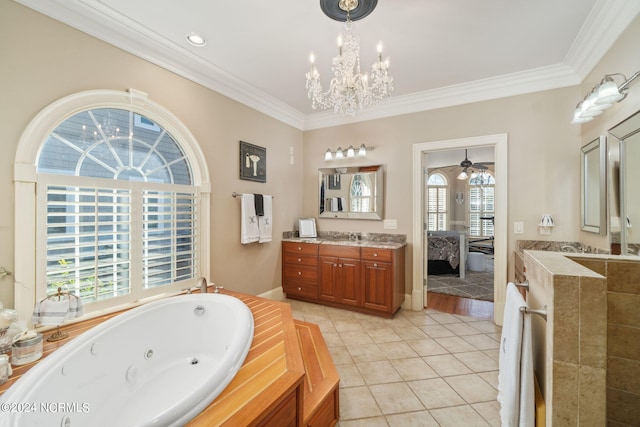 bathroom with vanity, a bathtub, tile patterned floors, and crown molding