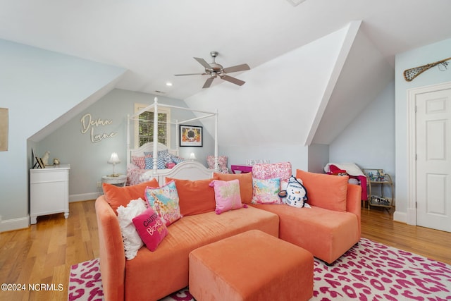 bedroom with vaulted ceiling, light hardwood / wood-style floors, and ceiling fan