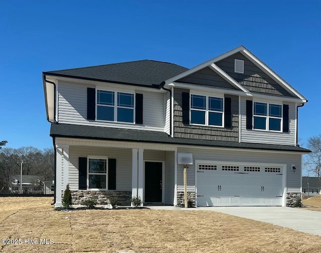 craftsman house featuring a garage, covered porch, a shingled roof, stone siding, and driveway