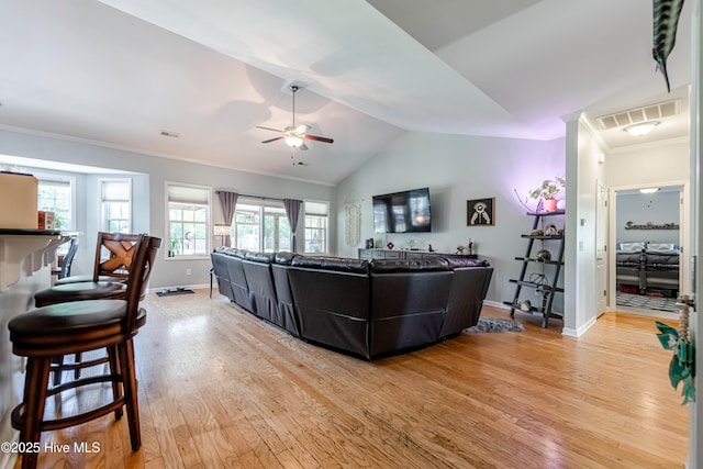 220 Everett Yopp Dr, Sneads Ferry, NC 28460 - living room with a ceiling fan, light wood-type flooring, vaulted ceiling, and crown molding