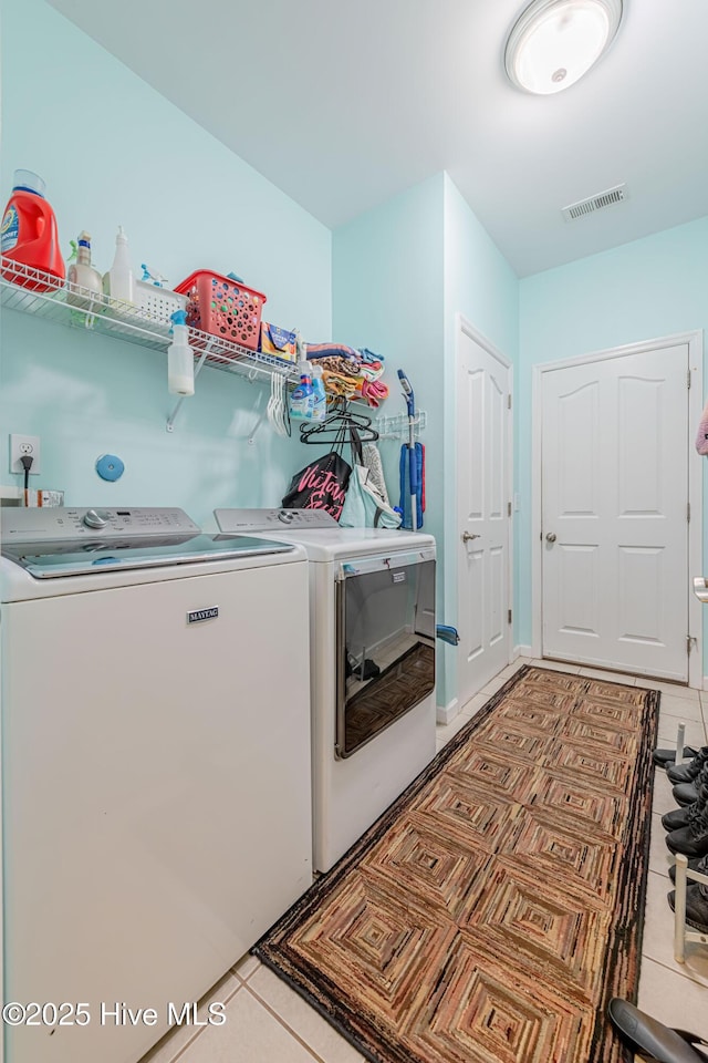 220 Everett Yopp Dr, Sneads Ferry, NC 28460 - laundry room featuring washer and clothes dryer and light tile patterned flooring