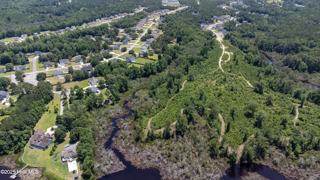 220 Everett Yopp Dr, Sneads Ferry, NC 28460 - aerial view of property's location with a forest and a large body of water