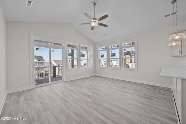 unfurnished living room with lofted ceiling, ceiling fan, and light hardwood / wood-style flooring