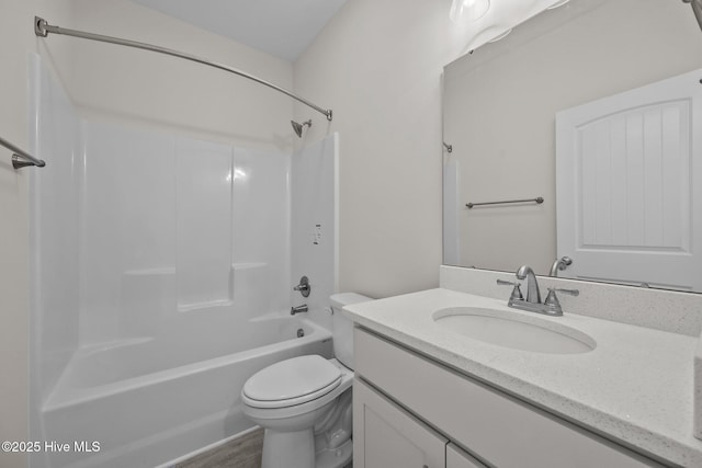 full bathroom with shower / bathing tub combination, vanity, toilet, and hardwood / wood-style flooring