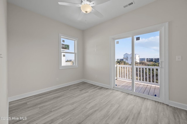 unfurnished room with ceiling fan and light hardwood / wood-style flooring