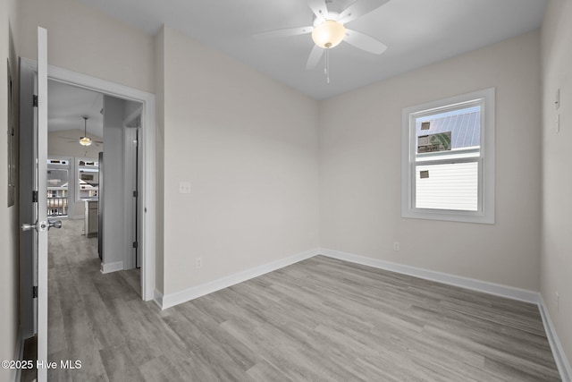 spare room featuring ceiling fan and light hardwood / wood-style flooring