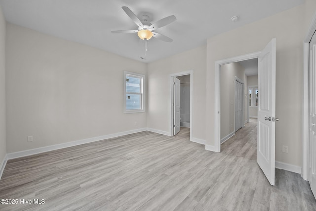 unfurnished bedroom with ceiling fan and light hardwood / wood-style floors