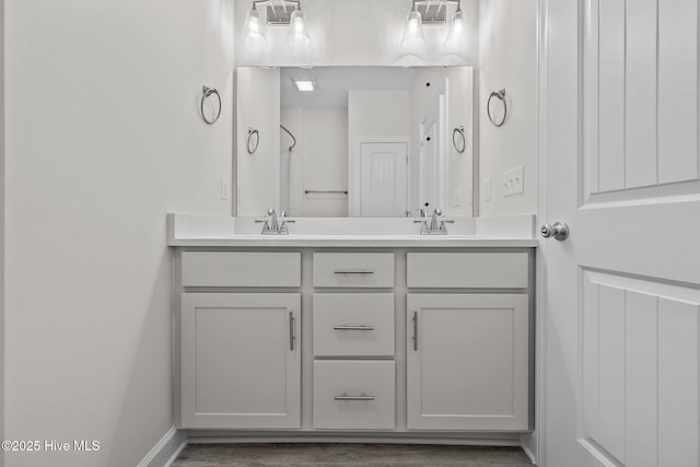 bathroom featuring vanity and hardwood / wood-style floors