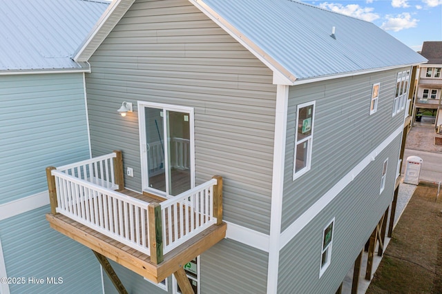 back of property with a balcony