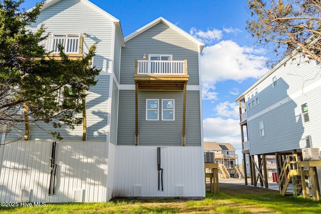 rear view of house featuring a balcony