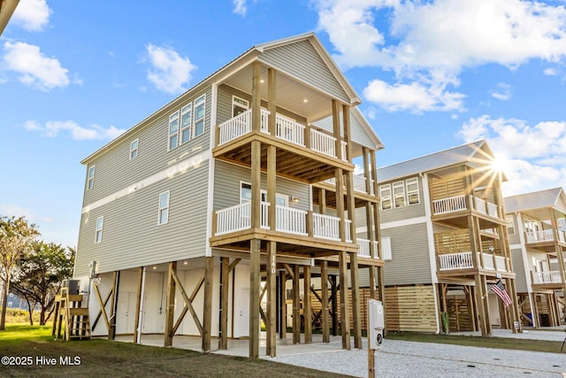 rear view of property featuring a balcony