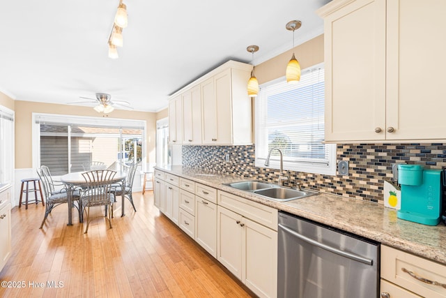 27 Newport St, Ocean Isle Beach, NC 28469 - kitchen featuring dishwasher, a sink, crown molding, plenty of natural light, and a ceiling fan