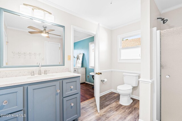 27 Newport St, Ocean Isle Beach, NC 28469 - full bathroom featuring toilet, wood finished floors, vanity, a ceiling fan, and ornamental molding