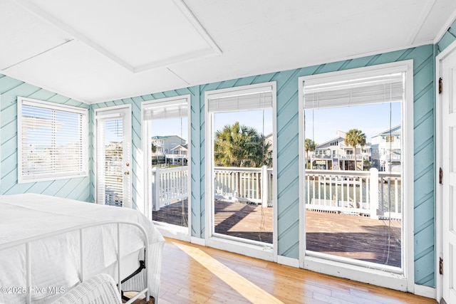 27 Newport St, Ocean Isle Beach, NC 28469 - bedroom with wood finished floors and access to outside