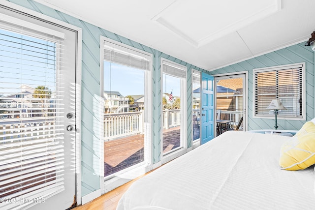 27 Newport St, Ocean Isle Beach, NC 28469 - bedroom with access to outside and wood finished floors