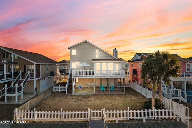27 Newport St, Ocean Isle Beach, NC 28469 - rear view of house with a patio area and a deck