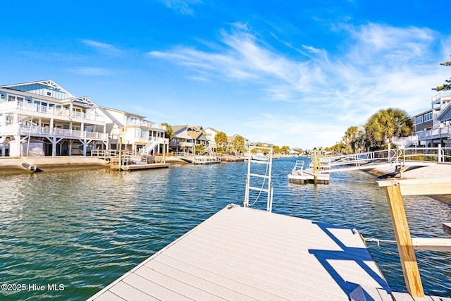27 Newport St, Ocean Isle Beach, NC 28469 - dock area featuring a water view and a residential view