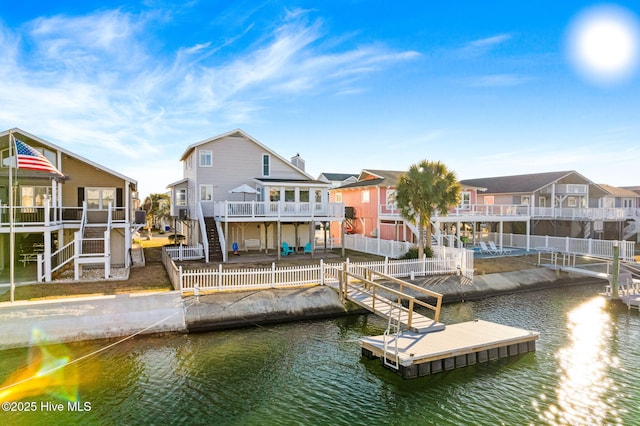 view of dock with a deck with water view