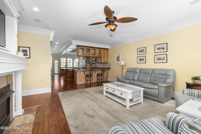 116 Salter Path Rd Unit 102Seabrook, Pine Knoll Shores, NC 28512 - living area with crown molding, a fireplace, ceiling fan, dark wood-style flooring, and recessed lighting