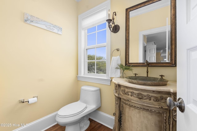 116 Salter Path Rd Unit 102Seabrook, Pine Knoll Shores, NC 28512 - bathroom with baseboards, toilet, vanity, and wood finished floors
