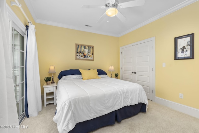 116 Salter Path Rd Unit 102Seabrook, Pine Knoll Shores, NC 28512 - bedroom with light colored carpet, crown molding, baseboards, a ceiling fan, and a closet