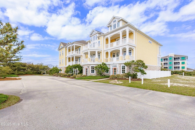 116 Salter Path Rd Unit 102Seabrook, Pine Knoll Shores, NC 28512 - view of front of house featuring fence and a balcony