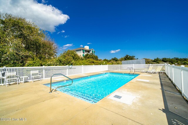 116 Salter Path Rd Unit 102Seabrook, Pine Knoll Shores, NC 28512 - view of swimming pool featuring a patio area and fence