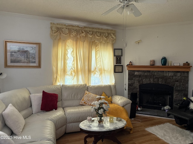 living area featuring a ceiling fan, wood finished floors, and ornamental molding