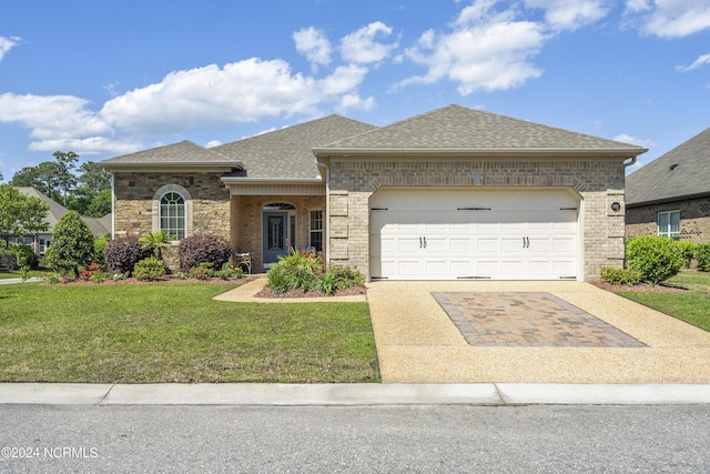 view of front of home with a garage and a front yard