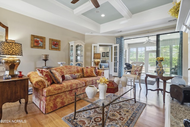 living room featuring beam ceiling, light hardwood / wood-style flooring, coffered ceiling, and ornamental molding