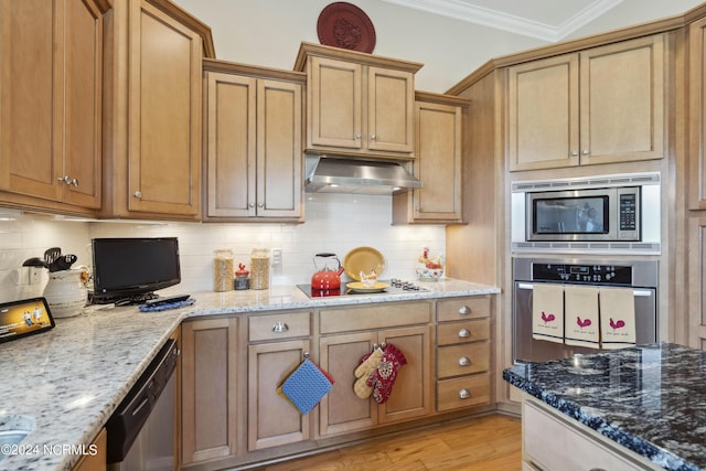 kitchen featuring backsplash, crown molding, light stone counters, and stainless steel appliances