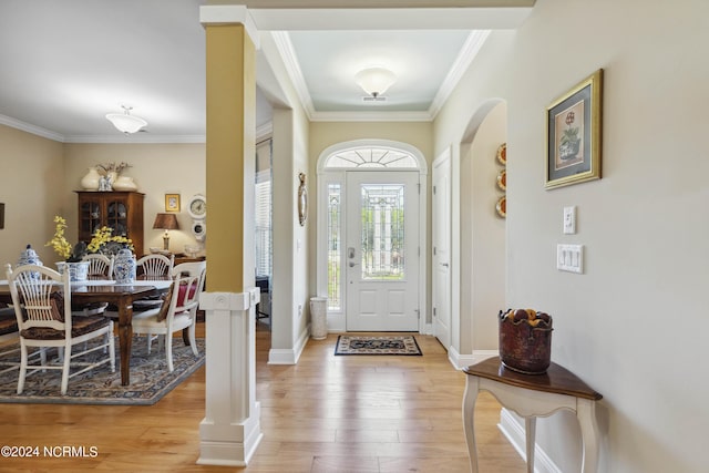 entryway with hardwood / wood-style flooring and ornamental molding