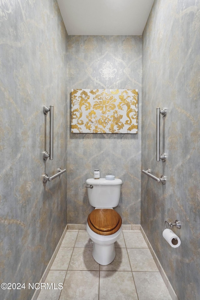 bathroom featuring tile patterned floors and toilet