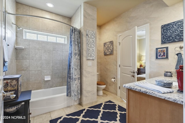 full bathroom featuring toilet, tile patterned flooring, vanity, and shower / tub combo with curtain