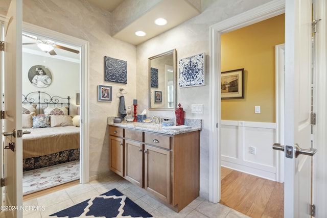 bathroom featuring ceiling fan, tile patterned flooring, and vanity