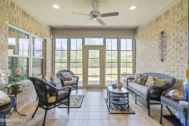 sunroom / solarium with ceiling fan and a healthy amount of sunlight