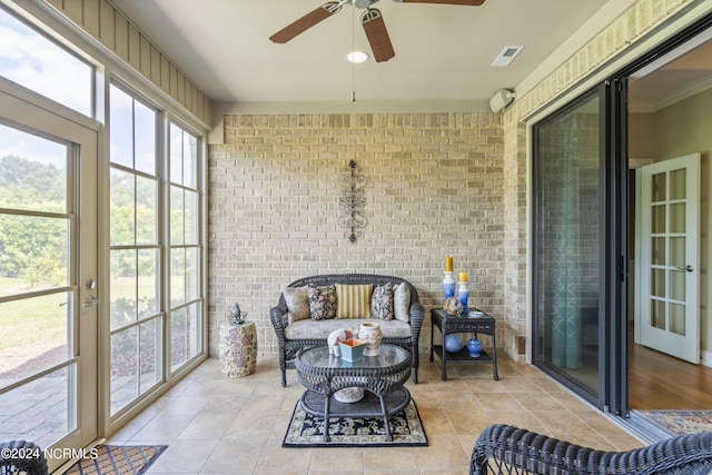 sunroom / solarium with ceiling fan