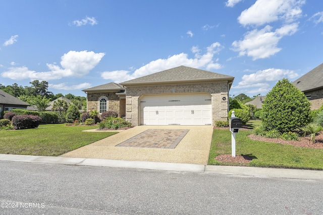 view of front of house with a garage and a front yard