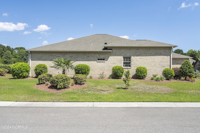 view of property exterior with a yard