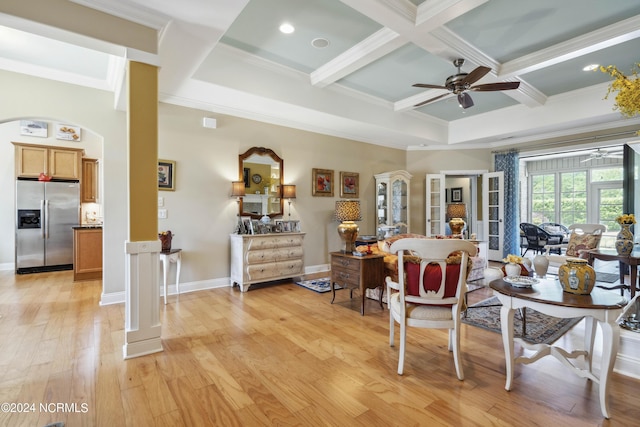 interior space featuring coffered ceiling, ceiling fan, crown molding, beamed ceiling, and light hardwood / wood-style floors