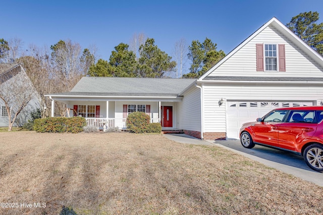 view of front of house with a front yard, a porch, and a garage