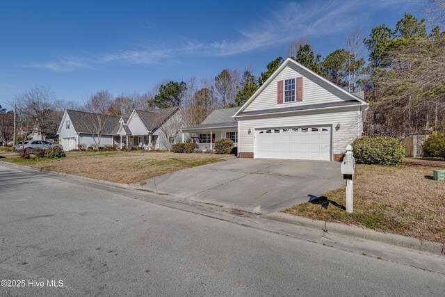 view of front of property with a porch and a garage